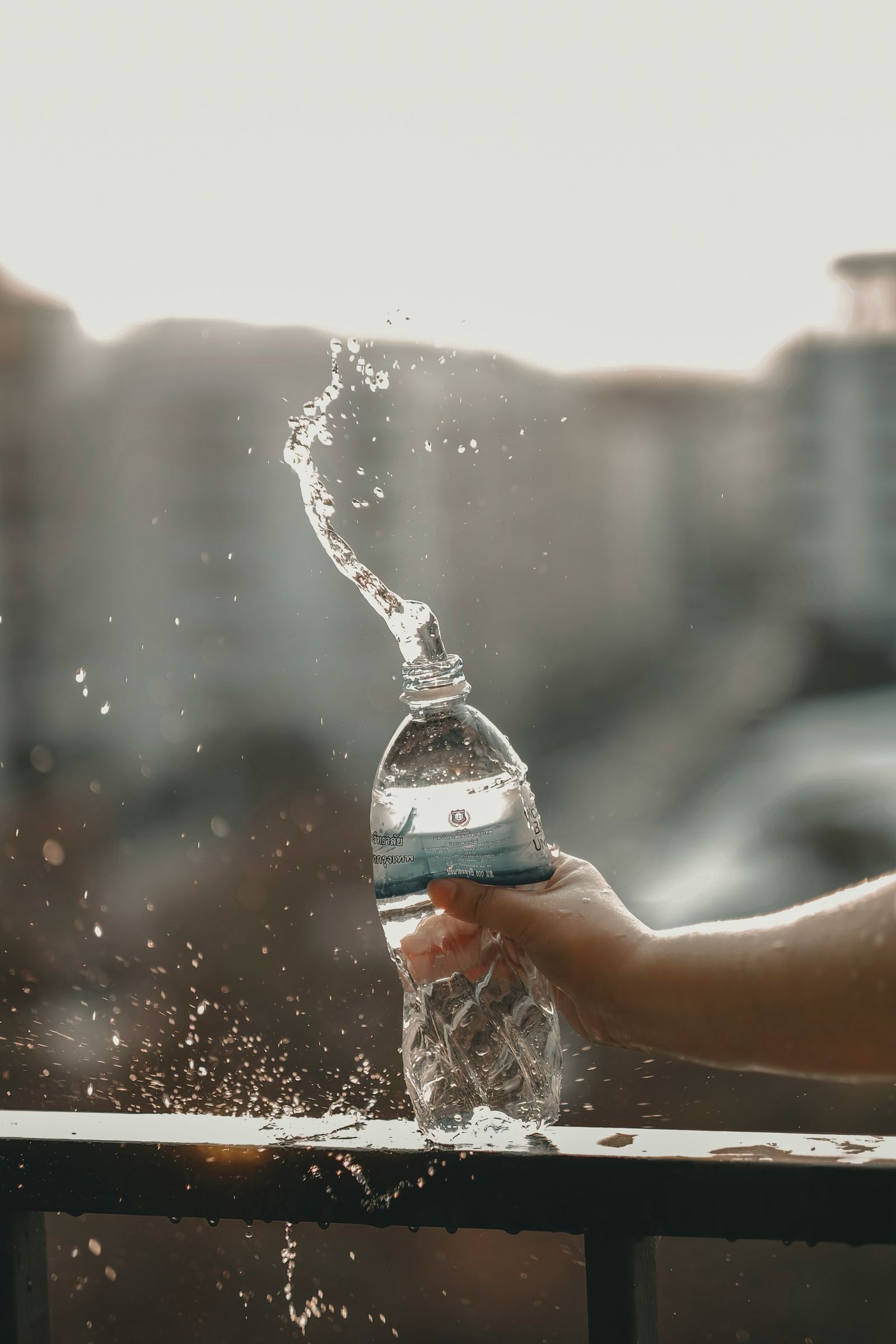 Water being poured from a bottle into a glass