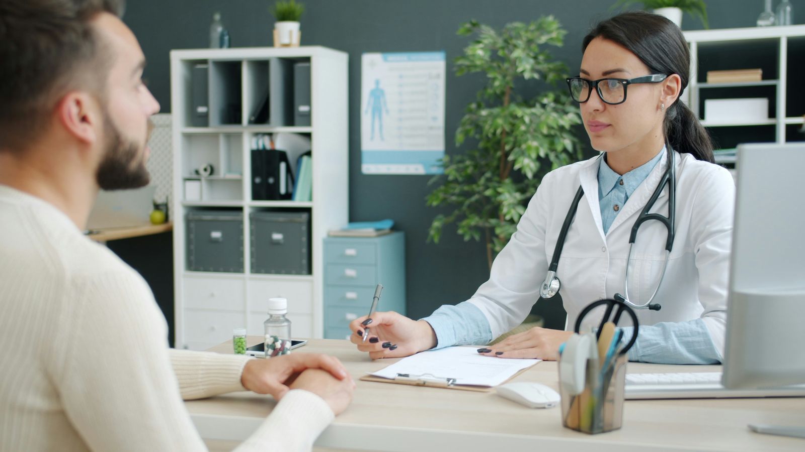 Doctor consulting with a patient in a clinic office