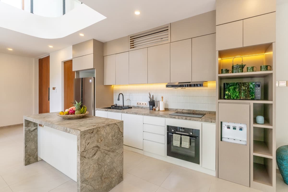 Modern fully-equipped kitchen with marble island at Hubuddha Three Bedroom Villa Ubud Bali
