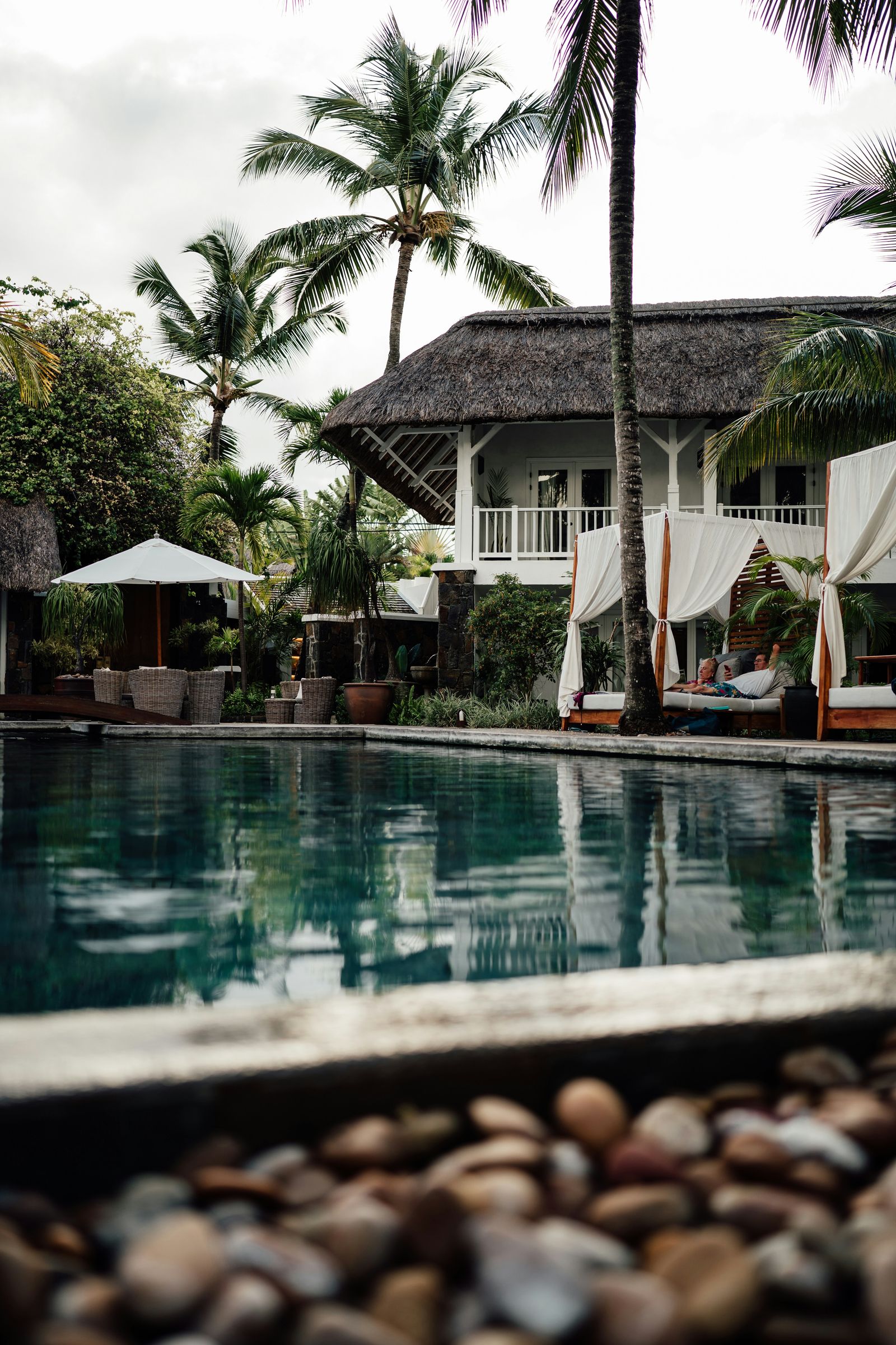 Aerial view of an Ubud resort pool surrounded by trees