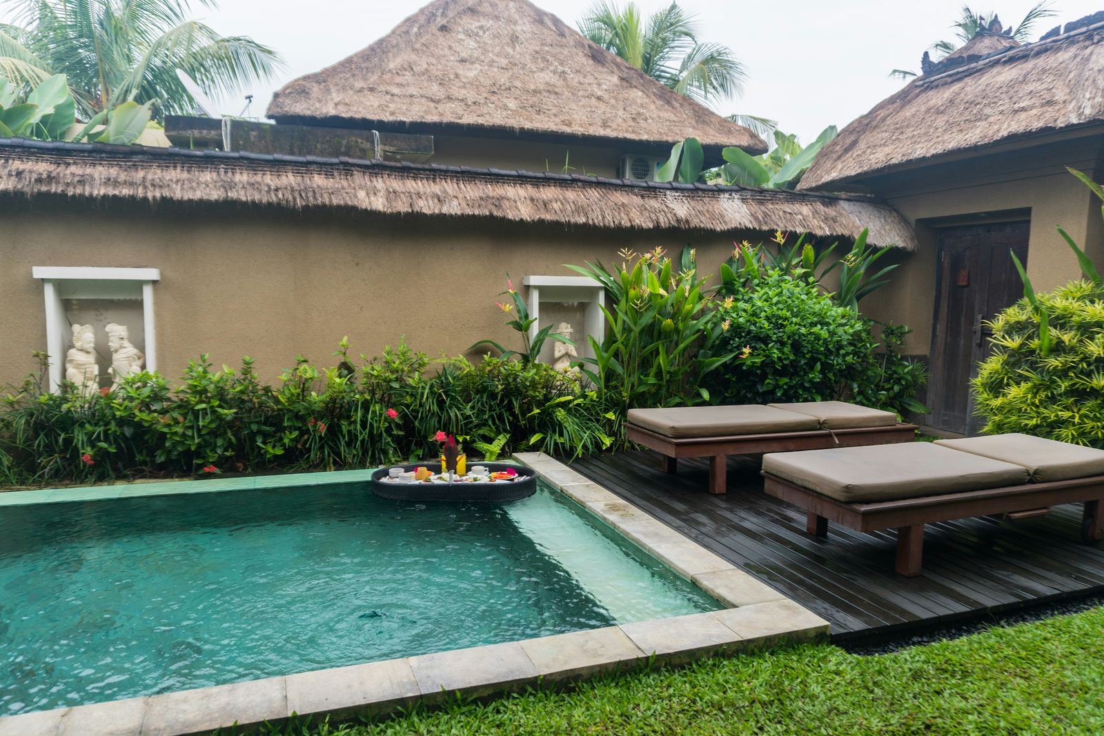 Small luxury villa pool with lounge chairs in Ubud