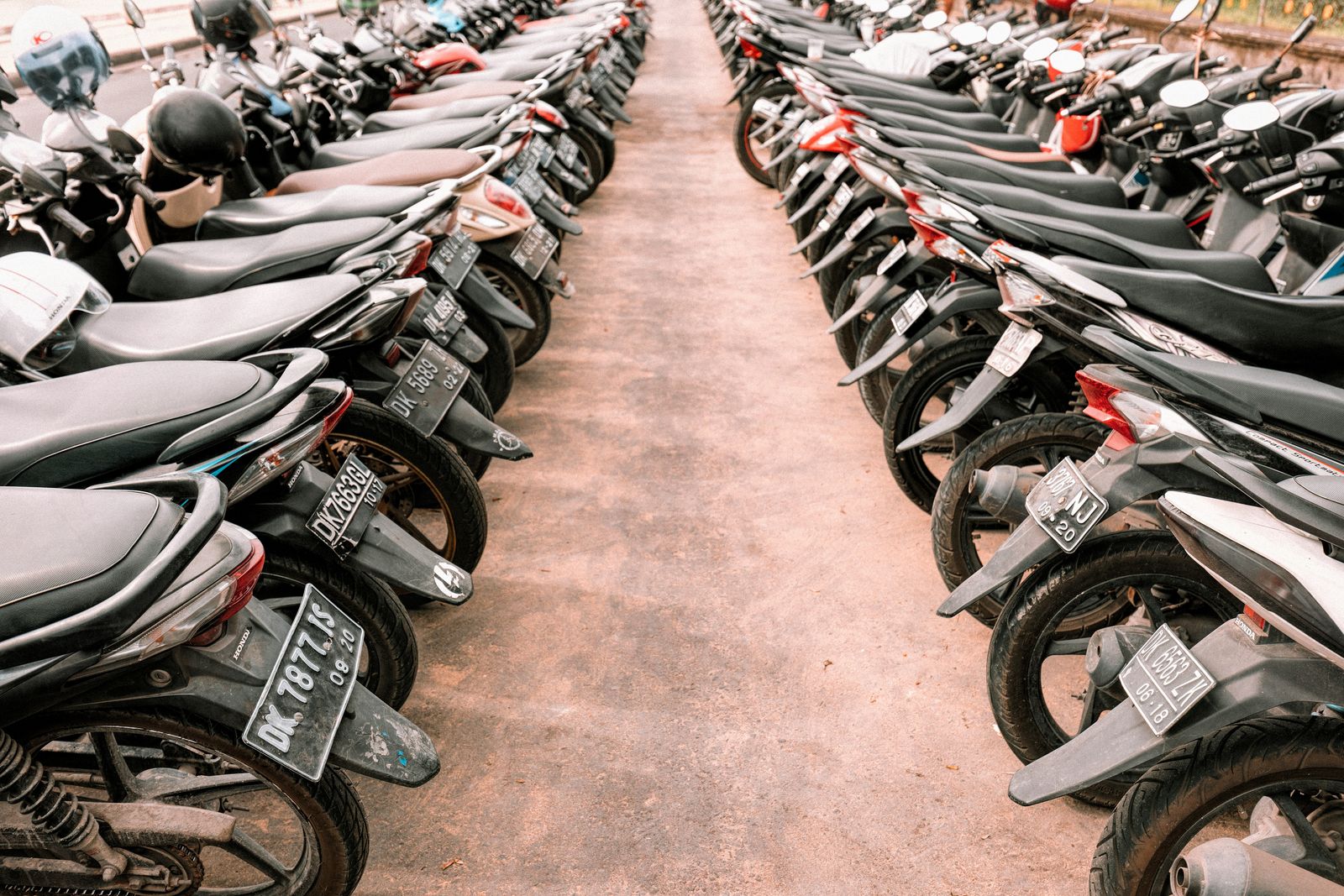 Rows of parked scooters in Bali showing how scooter-heavy Canggu can feel