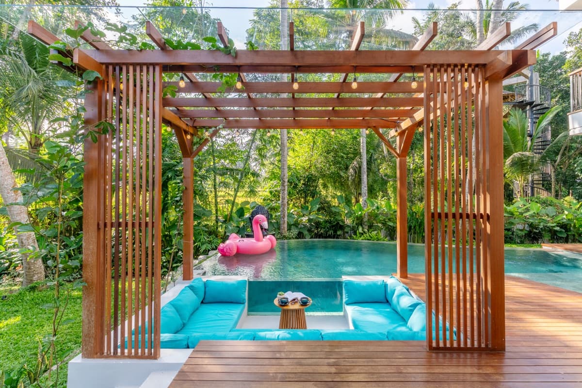 Sunken gazebo surrounded by lush tropical garden at Hubuddha Three Bedroom Villa Ubud Bali