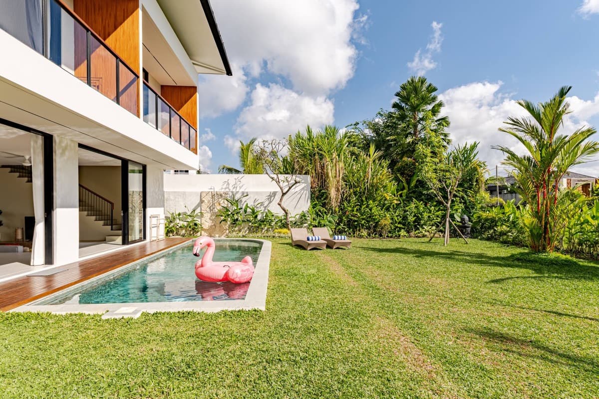 Private pool with flamingo float and tropical garden at Hubuddha Two Bedroom Villa Ubud Bali